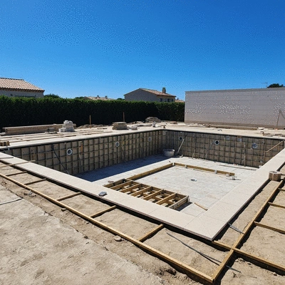 Modern swimming pool under construction in Hyères with a clear blue sky