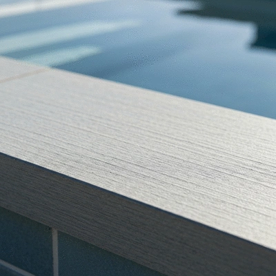 Close-up of eco-friendly, textured non-slip pool coping material, modern design, durable, natural light, no text, no words, no typography, no labels, clean image